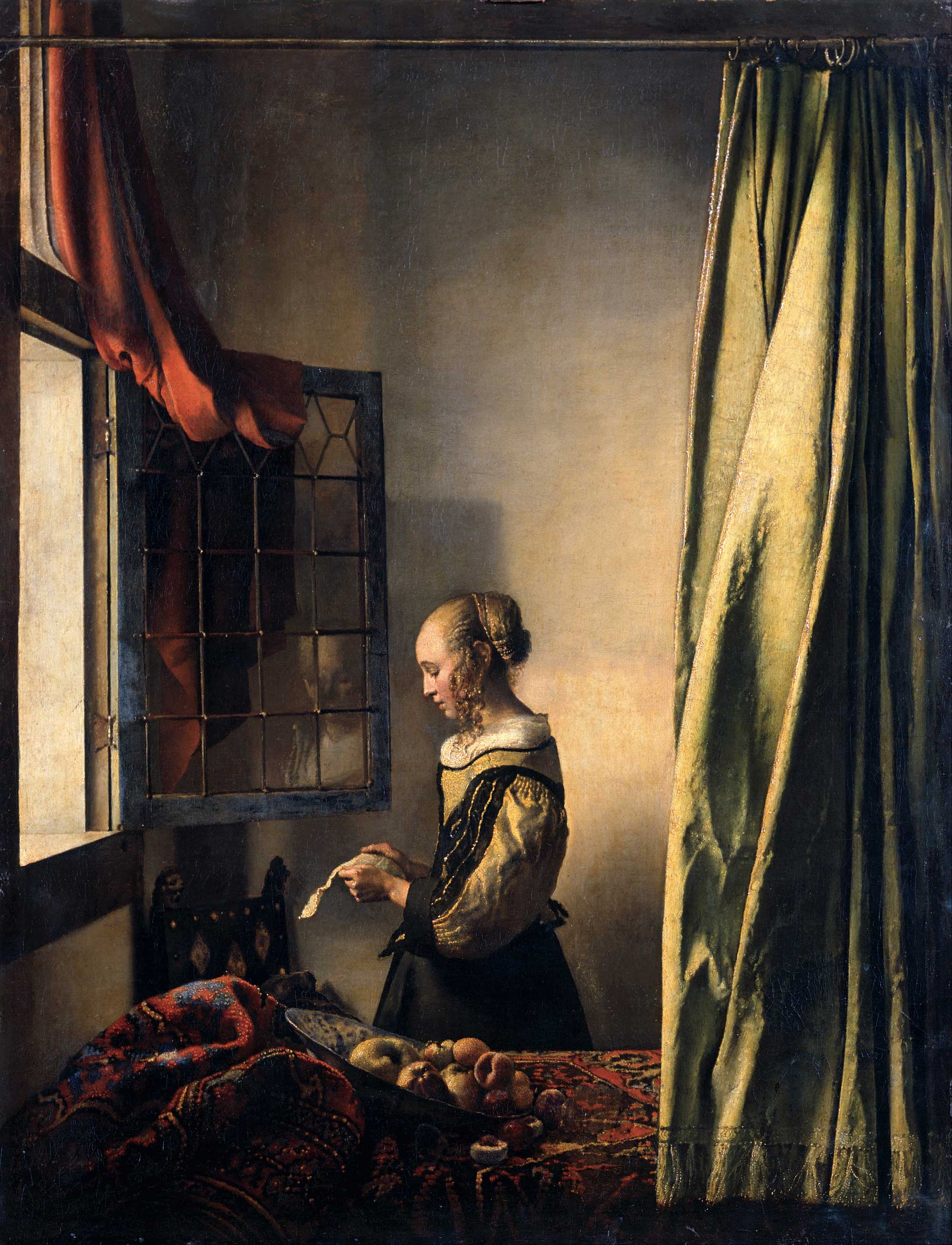 Vermeer-Girl_Reading_a_Letter_by_an_Open_Window